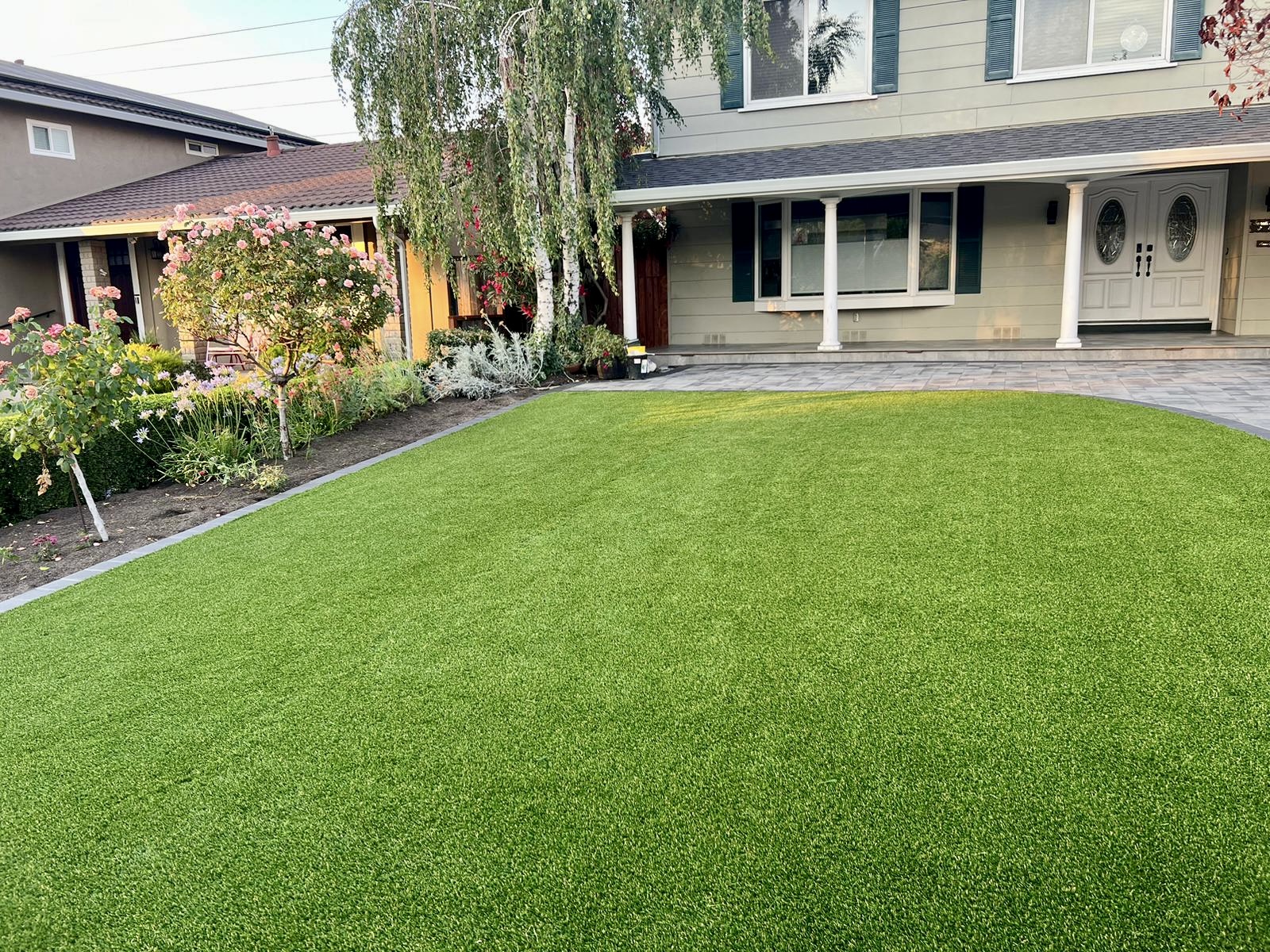 Complete front yard with artificial turf and paver border