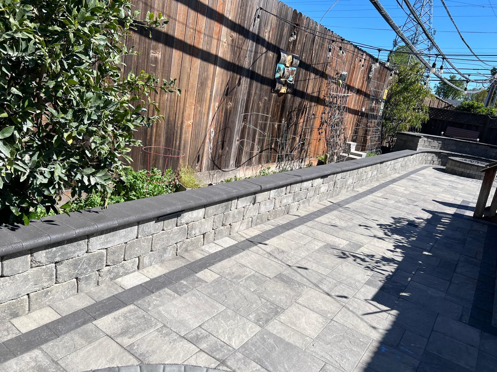 Close-up view of stone retaining wall and paver detail